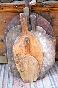 an old wooden cutting board sitting on top of a table