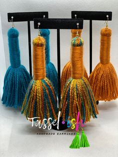 three tassels are hanging from a rack