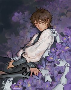 a man sitting on the ground surrounded by purple flowers with scissors in his hand,