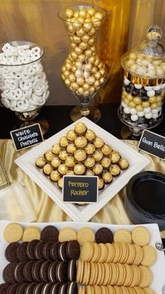 an assortment of cookies and desserts displayed on a table