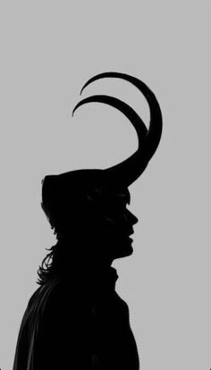 the silhouette of a man with horns on his head