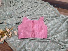 Blouse stitched - Yes Blouse Opening - Back Padded - No Blouse size - 36 with inner margins expandable upto 42 For Blouse Size 34 alteration can be done on request. Pink Sleeveless Blouse Piece With Padding, Sleeveless Pink Padded Blouse Piece, Sleeveless Padded Pink Blouse Piece, Pink Sleeveless Padded Blouse Piece, Fitted Sleeveless Vest For Festive Occasions, Pink Sleeveless Padded Blouse, Pink Sleeveless Padded Top, Festive Pink Sleeveless Blouse, Fitted Sleeveless Pink Blouse Piece