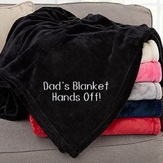 a blanket that says dad's blanket hands off on it sitting on a couch