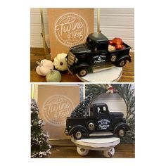 an old black truck sitting on top of a table next to a box of fruit