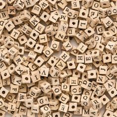 wooden alphabet beads with letters and numbers on them