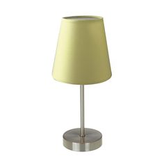 a lamp that is on top of a metal base with a yellow shade over it