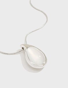 Make a statement with our Agate Teardrop Necklace. Crafted from 18k white gold filled, this necklace features a genuine white agate pendant that exudes elegance and sophistication. Perfect for adding a touch of luxury to any outfit. White Teardrop Jewelry With Polished Finish, Chic Silver Teardrop Pendant Jewelry, Elegant Drop Necklace With Large Pendant, Timeless White Drop Jewelry, Elegant White Gold Teardrop Pendant Necklace, Elegant Teardrop Drop Necklace With Large Pendant, White Sterling Silver Necklace With Polished Finish, White Oval Pendant With Polished Finish, Timeless White Gemstone Necklace