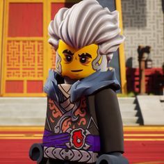 the lego movie character is standing in front of a yellow and red building with white hair