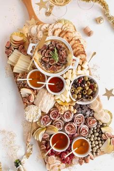 a platter filled with different types of food and condiments on top of it