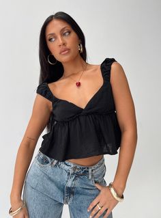 Crop top V-neckline, cap sleeve, frill hem Slight stretch, partially lined 100% cotton Cold machine wash Black Top Outfit, Babydoll Tops, Going Out Shirts, Singlet Tops, Corsets And Bustiers, Long Sleeve Tops Casual, Strapless Tops, Woven Top, Buy Now Pay Later