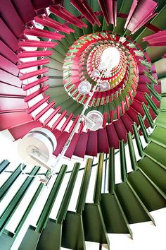 a spiral staircase made up of many different colors