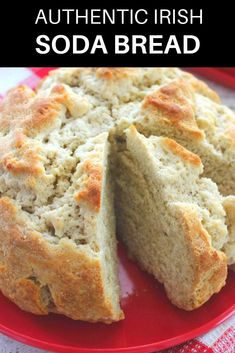 irish soda bread on a red plate with the words irish soda bread cut in half