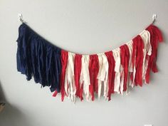 a red, white and blue banner hanging on the wall