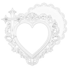 a white heart shaped plate with a cross on the front and an ornate border around it