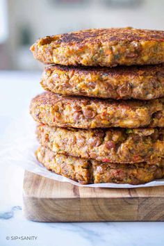 a stack of food sitting on top of a wooden cutting board