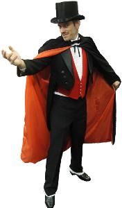 a man in a tuxedo and top hat is holding an orange cape over his shoulder