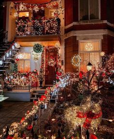 a house decorated with christmas lights and wreaths