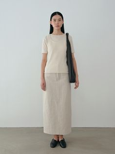 This is a trendy and unique skirt by MOIA that is made out of high quality and sturdy fabric. With refined design detail and trendy mood, you can style it for your casual and trendy daily outfit.- Minimal and clean design- Back vent detail- Stitches detail - Sturdy cotton and linen blend fabric Beige Cotton Asymmetrical Skirt, Beige Asymmetrical Cotton Skirt, Asymmetrical Cotton Skirt In Beige, Relaxed Neutral Maxi Skirt, Elegant Beige Cotton Maxi Skirt, Chic Relaxed Skirt For Everyday, Beige Cotton Pencil Skirt, Chic Beige Cotton Skirt, Beige Casual Maxi Skirt For Work