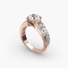 a rose gold engagement ring with baguettes and channeled diamonds on the side