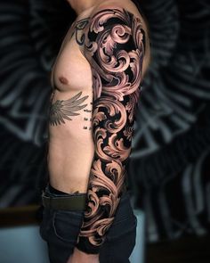 a man with a tattoo on his arm