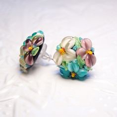 "These rosy, turquoise and white flowers lampwork studs is perfect for woman in any situation. Artist lampwork beads are made by me, one by one in a lampwork technique. These lampwork earrings is very tender and unique! Dimentions: diameter about 6/8\" inch (20 mm), see last photo for exact dimensions. Materials: artist lampwork beads, metal fittings. Colors used: rosy, turquoise, white, green, yellow. For your information: ✦ Get free shipping when you buy any two or more items! ✦ All jewelry is Green Czech Glass Flower Earrings, Czech Glass Flower Earrings For Gifting, Czech Glass Flower Earrings For Gifts, Handmade Turquoise Flower Earrings, Turquoise Czech Glass Flower Earrings For Gift, Turquoise Flower Earrings, Glass Flower Earrings, Boho Nature, Botanical Earrings