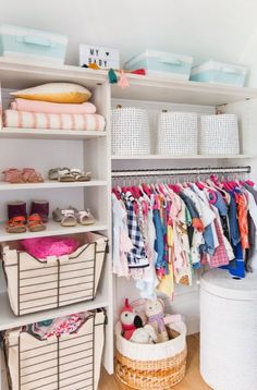 an organized closet with clothes and baskets