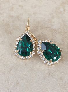 "Gorgeous pair of halo earrings featuring pear crystals in rich emerald green surrounded by a halo of sparkling clear crystals. The center stones in these are a beautiful, rich color! Rose gold, gold or silver plated settings. Shown in gold. Please select metal finish from the drop down menu at check out. The drop potion of the earring is 1 1/2 long, 3/4\" wide Thanks for stopping by." Quince Heels, Quince Hair, Purple Engagement Rings, Quince Nails, Emerald Green Earrings, Crystal Teardrop Earrings, Blue Crystal Earrings, Blue Green Gold, Prom Earrings