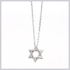 This sparkling necklace is a newer version of the classic Star of David. The perfect size to wear all the time with sparkling CZ pavé to catch the eye. The star moves freely on a delicate chain. Available in sterling silver or gold vermeil. Pendant is 1/2" in diameter, hung on a 16" sterling silver chain with 2" extender. Made by Felix Z Designs Fine Jewelry Cubic Zirconia Star Necklace, Star-shaped Sparkling Cubic Zirconia Necklaces, Sterling Silver Star Necklace With Diamond Accents, Star-shaped Cubic Zirconia Necklace For Anniversary, Star-shaped Cubic Zirconia Diamond Necklace Gift, Dazzling Star-shaped White Gold Necklace, Dazzling Star Shaped White Gold Necklace, Dazzling White Gold Star Necklace, Sterling Silver Star Of David Fine Jewelry Necklace