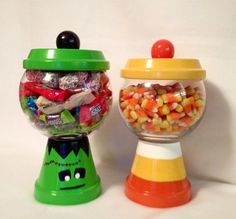 two candy dispensers sitting next to each other