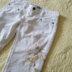 Never Worn! Tag Says Sz 26 (Sz 2/4)! Corduroy Material With Embroidered Floral Details, Fully Functioning Zipper And Button! Wrinkled From Storage, 1 Minor Spot On Back, (See Photo 10) Not Noticeable When Wearing! Condition: Nwot Fitted White Embroidered Bottoms, Fitted Embroidered White Pants, White Stretch Capris For Spring, Spring White Stretch Capris, White Embroidered Pants For Spring, White Fitted Capris For Summer, White Stretch Cotton Capris, Fitted White Embroidered Pants, Spring Embroidered White Pants