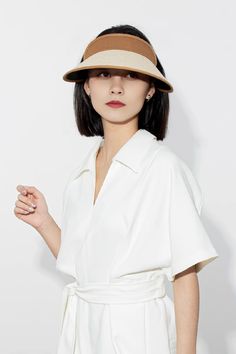 Stay effortlessly chic and protected with our adjustable UPF 50 wide-brim straw sun visor. Made with 100% paper straw and cotton-linen, it offers breathable comfort and stylish sun protection. Perfect for sunny days and outdoor adventures.