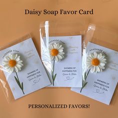 three personalized soap favors in cello bags with daisy flowers on them for mother's day