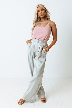 You are guaranteed to turn heads when you complete your look with our eye-catching light pear hued 'Jazzy' pants featuring lightweight shimmery material, a high waistline with a button closure, two side pockets, and a relaxed silhouette that falls straight into ankle-length hemlines!   Measurements S variant has  a Front Rise of 13",  a Hip of 36",  a Inseam of 30.5",  a Length of 43",  a Waist of 26".  M variant has  a Front Rise of 14",  a Hip of 38",  a Inseam of 30.5",  a Length of 43",  a W Green Wide Leg Pants For Night Out In Summer, Summer Ankle-length Wide Leg Pants For Night Out, Solid Color Pants For Summer Night Out, Summer Pants With Elastic Waistband For Night Out, Summer Night Out Pants With Elastic Waistband, High Waist Pants, Waist Pants, High Waisted Pants, Ankle Length