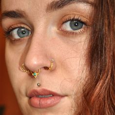 A gorgeous septum in ethnic shape, with small turquoise gemstone. For a pierced nose! It can be worn as tragus earrings or small hoop earrings as well. Description ♦ This listing is for a SINGLE ring. ♦ Material: sterling silver or gold plated silver or 18k solid gold - choose during checkout ♦ Set with a turquoise gemstone. ♦ Gauge / Bar size: 20G - 0.8mm (0.031'') ♦ Inner ring: 8mm (0.31'') ♦ Nickel Free! ♦ SHIPPING TO THE U.S WITHIN 5 BUSINESS DAYS! ♦ Need a different gauge? I can create a cu Indian Nose Piercing, Ethnic Nose, Boho Nose Ring, Nose Ring Gold, Pierced Nose, Nostril Ring, Gold Nose Ring, Nostril Piercing, Fake Gauge Earrings