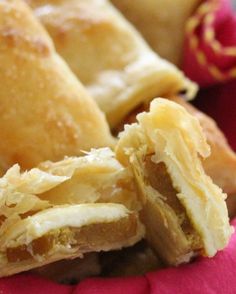 several pastries sitting on top of a pink cloth