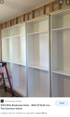 an unfinished room with white shelving being installed