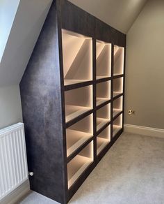 an empty room with some shelves in it