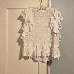 Medium Lightweight Lovestitch Blouse. Will Need A Cami Underneath Unless You Like A See Through Look! Flutter Sleeves And Single Button Neck Closure. Never Worn. White Eyelet Feminine Top, White Feminine Eyelet Top, Feminine White Eyelet Tops, Casual Sleeveless Broderie Anglaise Blouse, Daywear Tops With Lace Trim And Flutter Sleeves, Flutter Sleeve Tops With Lace Trim For Daywear, White Flutter Sleeve Tops For Vacation, Bohemian White Blouse With Flutter Sleeves, White Flutter Sleeve Top With Lace Trim