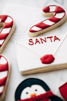 decorated cookies with santa written on them