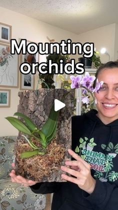 a woman holding up a potted plant with the words mountain orchids on it