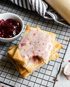 some crackers are sitting on a cooling rack with cranberry sauce