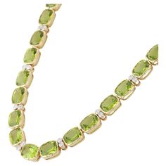 Peridot Necklace in 18K Gold studded with cushion cut peridot pieces and diamonds. Accessorize your look with this elegant peridot beaded necklace. This stunning piece of jewelry instantly elevates a casual look or dressy outfit. Comfortable and easy to wear, it is just as exquisite worn alone or layered with other charms for a modern fashion statement. PRODUCT DETAILS :- > Material - 18K Solid Yellow Gold > Gemstone - Peridot > Gemstone Weight - 78.5 ct > Gemstone Shape - Cushion > Gemstone Pcs Gold Gemstone Necklace, Queens Jewels, Outfit Comfortable, Dressy Outfit, Boho Chic Necklace, Gold Earrings Wedding, Peridot Necklace, Bead Necklaces, Peridot Stone