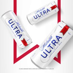 three cans of ultra are sitting next to each other on a red and white background