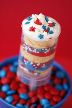 a stack of cupcakes with red, white and blue frosting