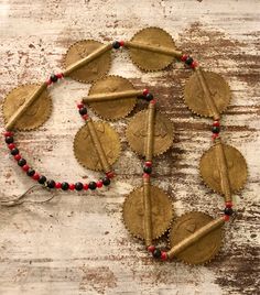 Beautiful Old Tribal Brass Disc Vintage Antique Necklace Old Tribal Jewelry Wearable Art Big bold beautiful Brass disk beads accompanied by small black and red resien spacer beads Very cool, wonderful to wear or keep in your special treasure box For a man or woman Necklace measures aprox 32 inches around each disc measures aprox 2 inches long by 1 1/2 inches wide Traditional Black Beaded Necklaces For Festivals, Traditional Red Necklaces With Black Beads, Traditional Red Necklace With Black Beads, Black Beaded Necklace With Large Beads For Festivals, Black Beaded Necklaces With Large Beads For Festivals, Bohemian Black Beaded Necklaces For Festivals, Bohemian Black Beaded Necklace For Festivals, Bohemian Red Necklace With Black Beads, Traditional Black Beaded Necklace For Festivals