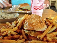 a hamburger and french fries on a table