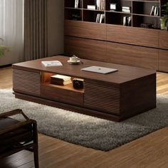 a living room with a coffee table and bookshelf