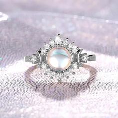 Elevate Your Ritual with Our Enchanting Opal Triple Moon Ring 🌙✨ Embrace the captivating power of the moon phases with our mesmerizing Opal Triple Moon Ring, a stunning piece of Wicca jewelry that celebrates the divine feminine. Crafted with stunning opal, this ring features the iconic triple goddess symbol, representing the Maiden, Mother, and Crone – the three phases of the lunar cycle. Whether you're a devotee of the Wiccan tradition, a practitioner of the magickal arts, or simply captivated by the allure of the moon, this Moon phases ring is the perfect accessory to adorn your ritual space and enhance your spiritual connection. The opal's iridescent shimmer and the intricate triple moon design make this ring a truly enchanting addition to your witchy jewelry collection. Elevate your m Mystical Moon Phase Ring, Adjustable Moonstone Ring With Moon Phase, Silver Magical Crystal Promise Ring, Magical Silver Crystal Promise Ring, Spiritual Open Ring Jewelry With Moon Phase, Spiritual Moon Phase Open Ring Jewelry, Moonstone Rings With Moon Phase Design, Mystical Silver Open Crystal Ring, Moon Phase Moonstone Rings