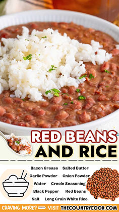 red beans and rice in a white bowl on a table next to a glass of beer