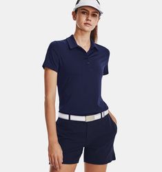 a woman in shorts and a polo shirt